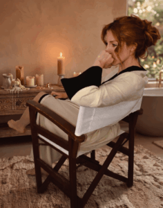 Atmospheric interior photography of the beige Isichastirio Kimono with black details, showcasing the essence of quiet luxury and serenity.